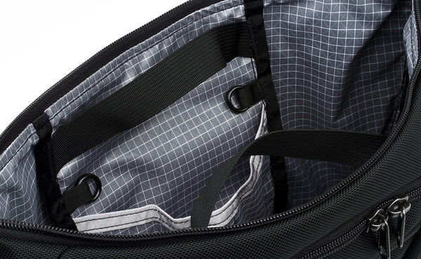 Close shot of zippable interior pockets in the main compartment.